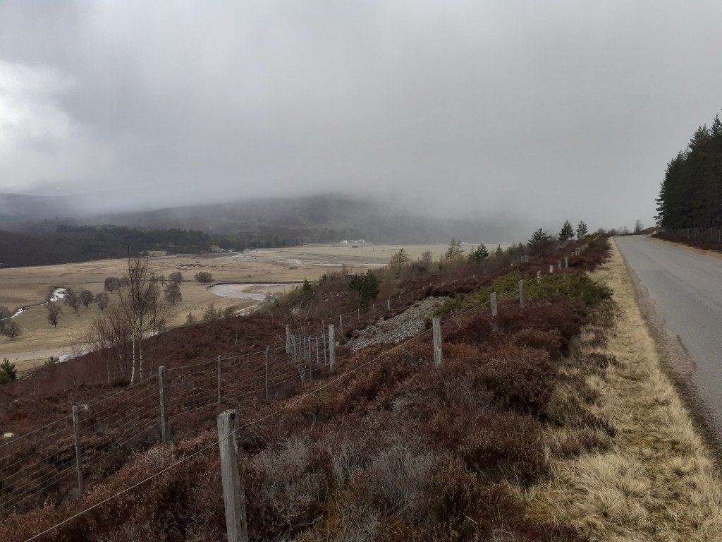 Incoming showers of hail seen from the road to Linn of Dee