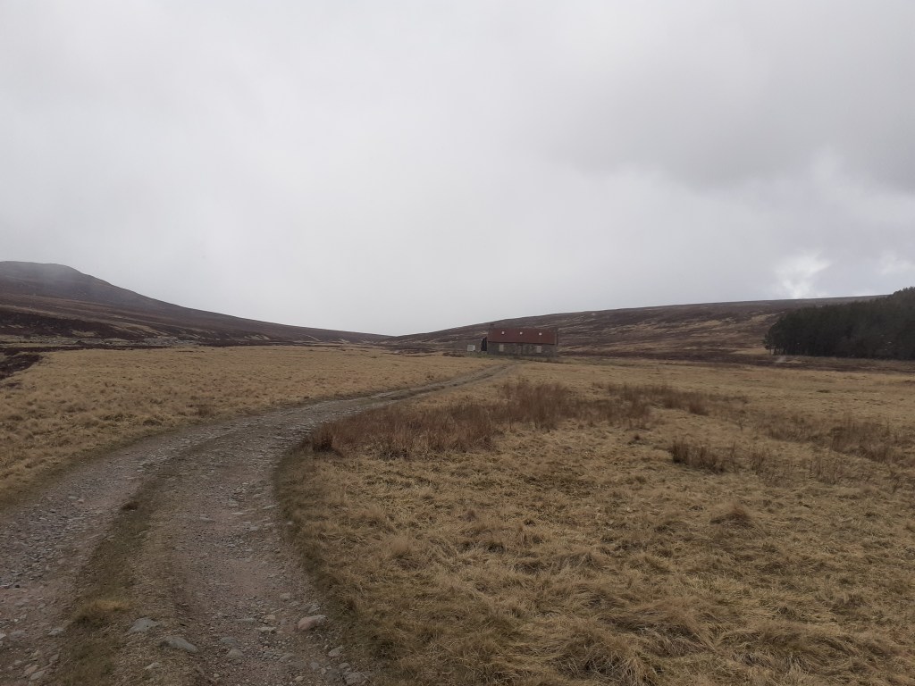 A bothy seen from where the track splits. Turn left for Blair Atholl, right for Glen Feshie