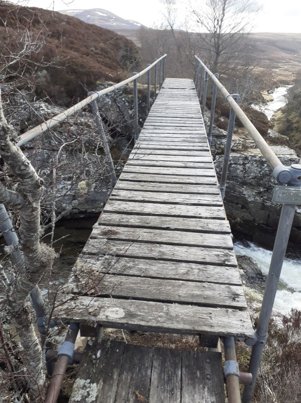 A rickety bridge spans the River Eidart - some of the wooden slats have seen better days