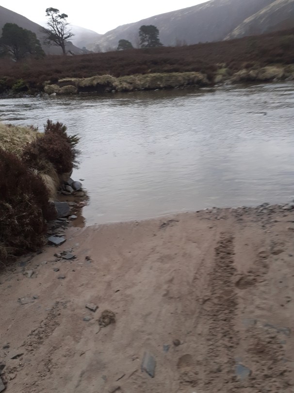 Safely over the other side. Because of erosion of the path the river had to be forded three times